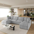 Gray U-shaped 6-seater sectional sofa in a modern living room with a kitchen in the background.