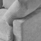 Gray fabric sofa with a close-up of the corner showing texture and stitching.