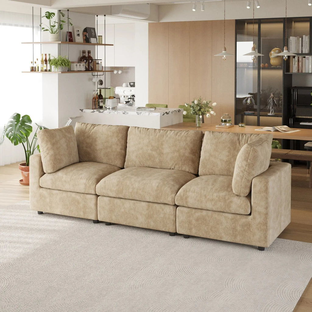 Khaki 3-seater sofa in a modern living room with a kitchen in the background