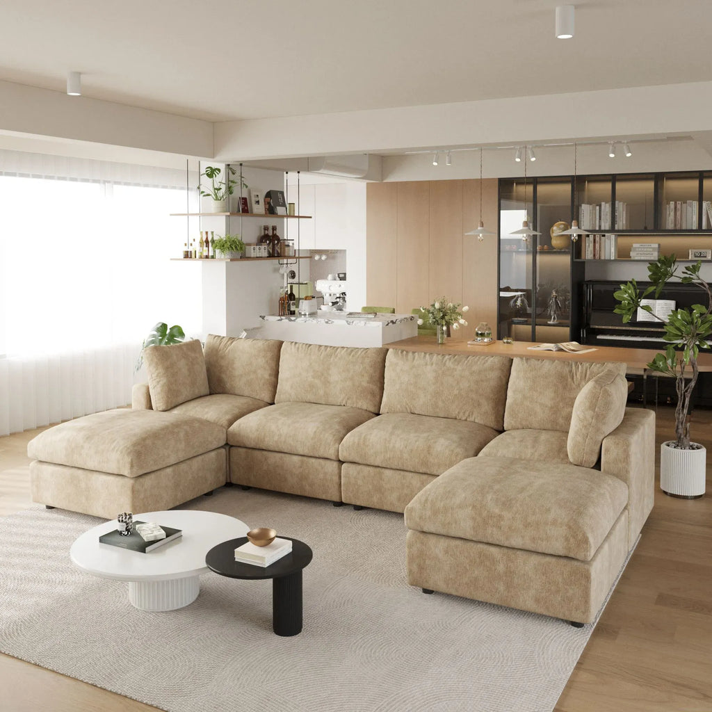 Khaki U-shaped 6-seater sectional sofa in a modern living room with a kitchen in the background.