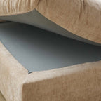 Close-up of a frame under seat cushion of a khaki colored sofa